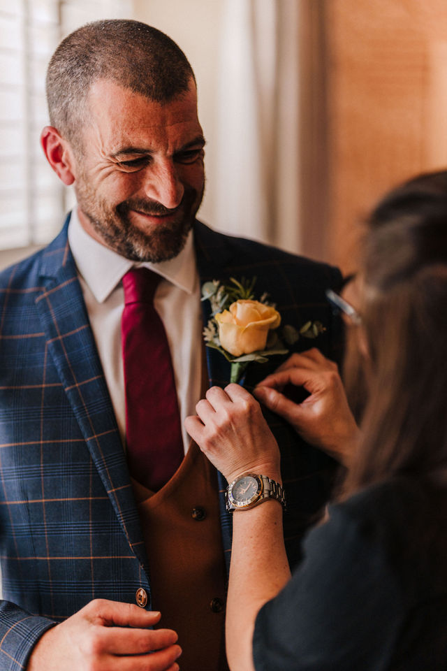groom morning preparations at the swan hotel in bibury